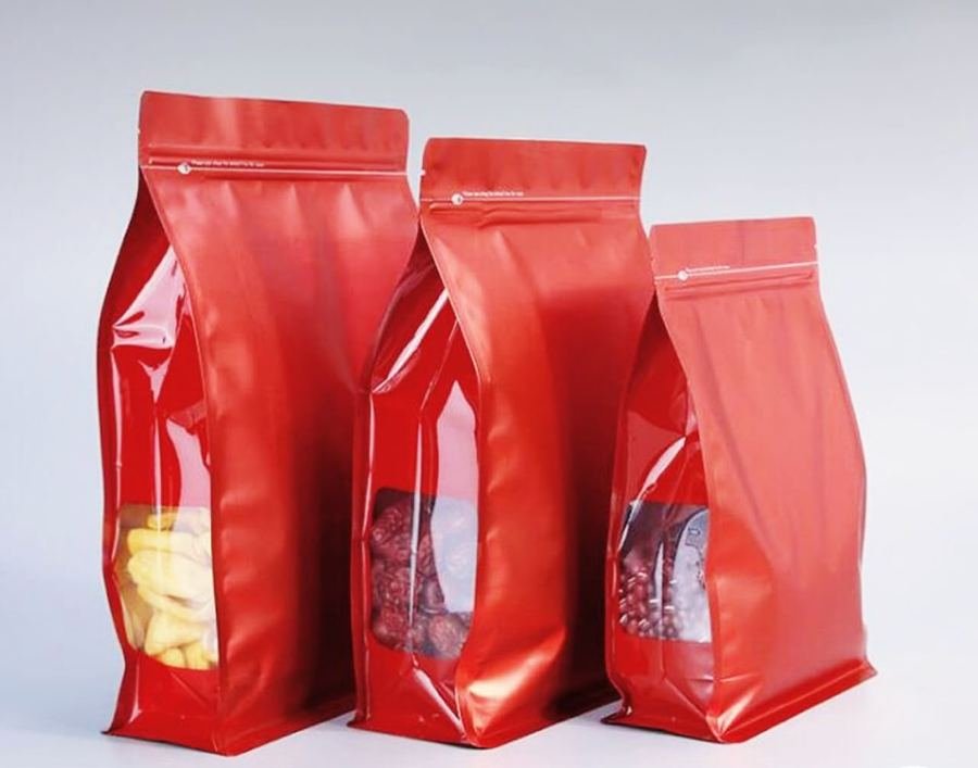 Red flat-bottom pouches in multiple sizes with resealable zip